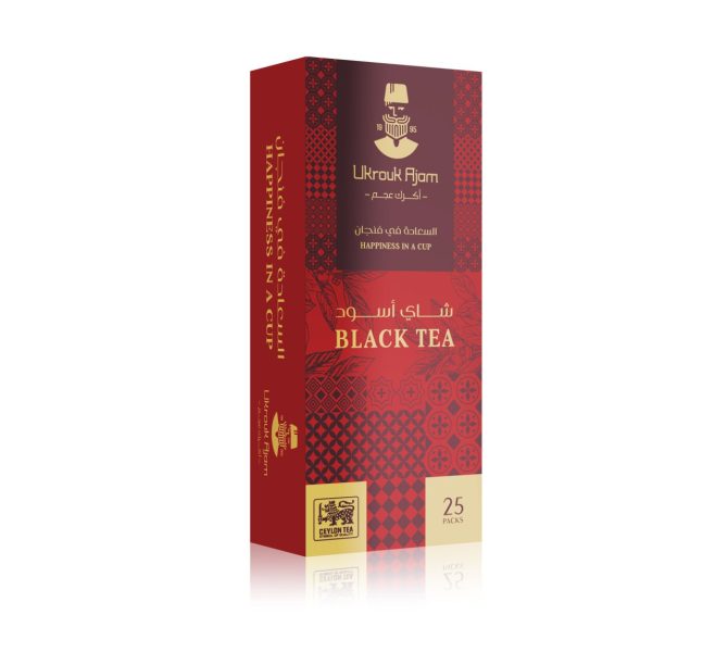 Ukrouk Ajam Black Tea in an elegant red box of 25 packs, detailed with traditional motifs and Arabic script, offering a premium Ceylon tea experience.