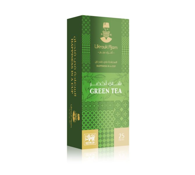 Vibrant green box of Ukrouk Ajam Green Tea containing 25 packs, adorned with traditional patterns and Arabic calligraphy, with the English slogan 'Happiness in a Cup'.